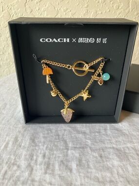 COACH x Observed by Us: Gold Tone Strawberry Bracelet